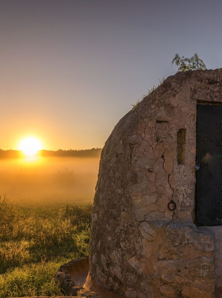 Sunset behind an old building