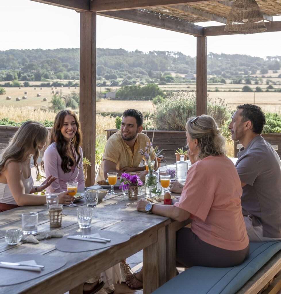 Friends enjoying an outdoor meal.